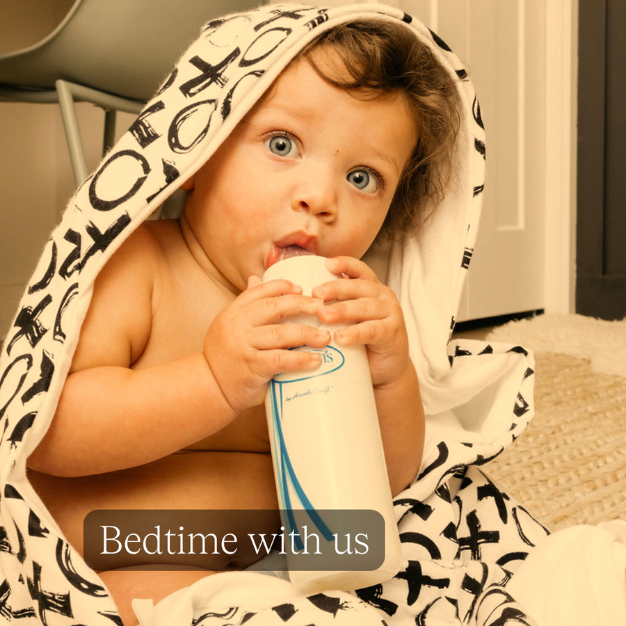 Bedtime with us: a calm baby wrapped in the hooded XO Oneberrie towel