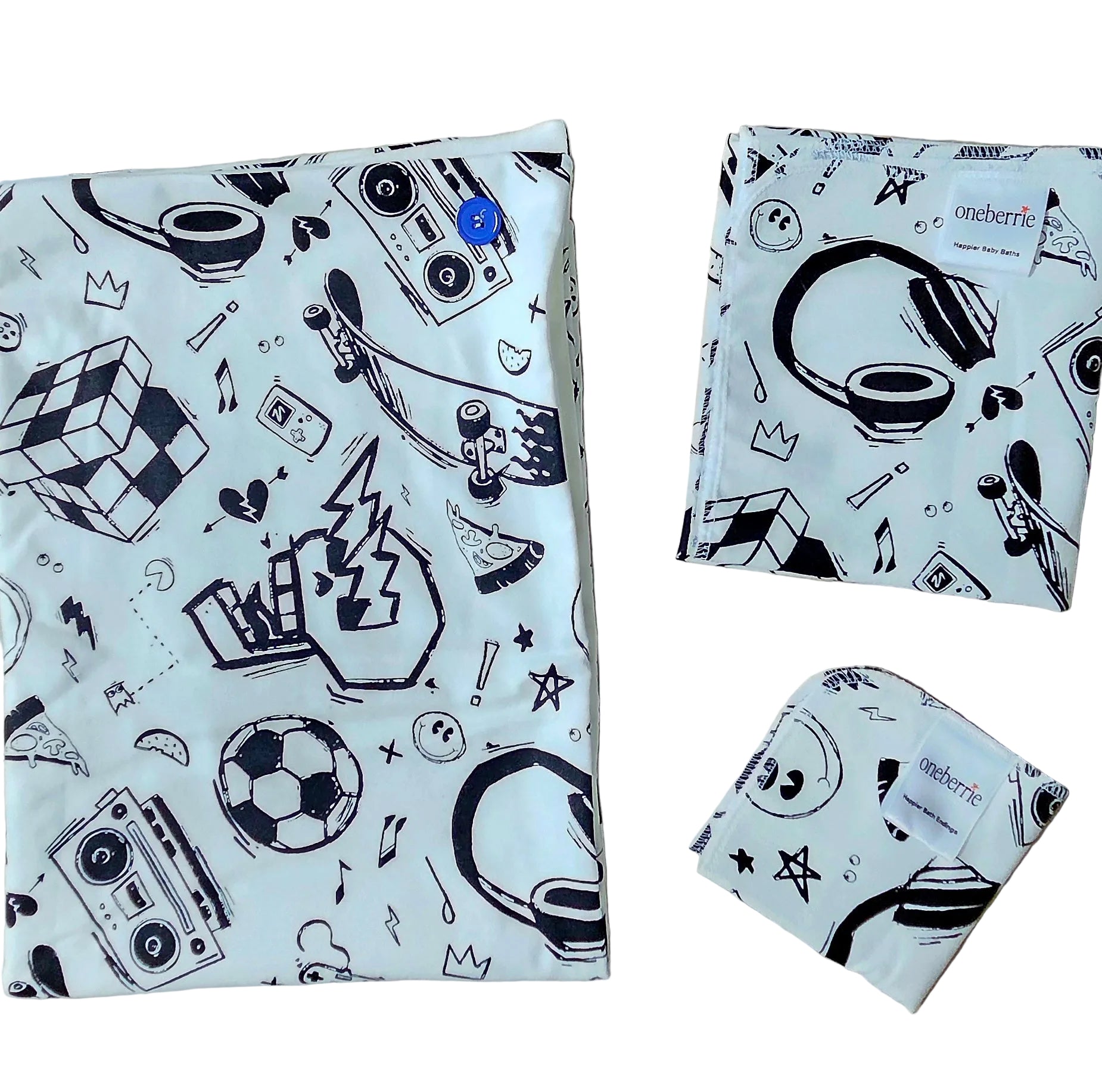Retro black and white print with skateboards, headphones and skull on a white flannel. Includes Hands free towel, washcloth and matching bath swaddle