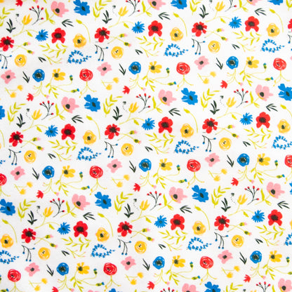 Oneberrie Hair Wrap Towel fabric close-up in wildflower print with red, blue, yellow and pink flowers on white