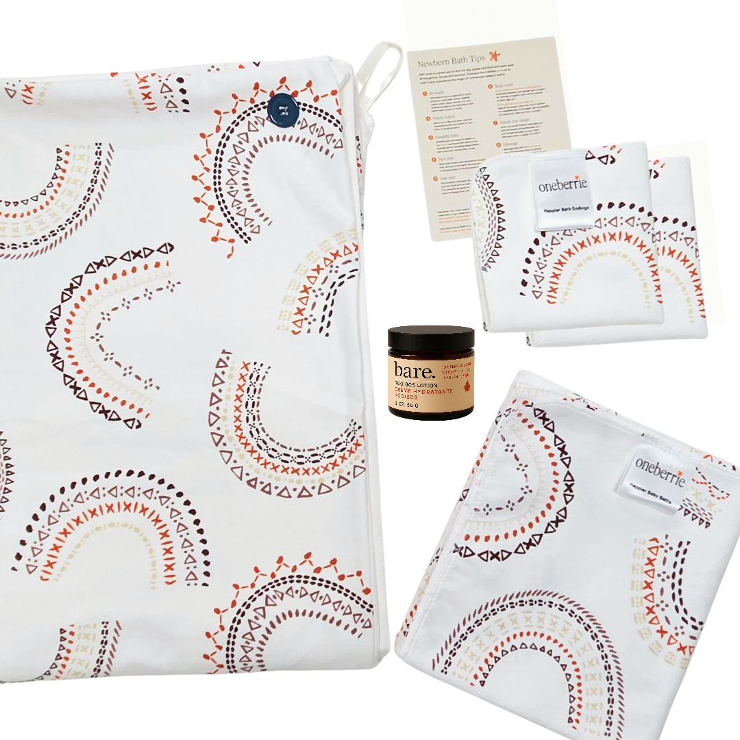 Newborn bath to bed set. Includes towel, washcloth, wipe, bath swaddle and 2oz lotion with a how to bathe a newborn method in Rainbow print.