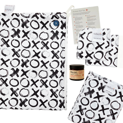 Newborn bath to bed set. Includes towel, washcloth, wipe, bath swaddle and 2oz lotion with a how to bathe a newborn method in XO print.
