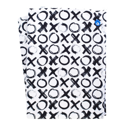 A soft baby towel with a black and white xo pattern and a blue button
