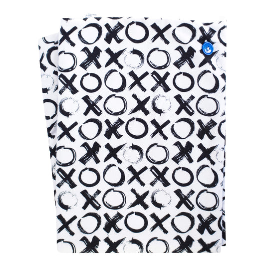 A soft baby towel with a black and white xo pattern and a blue button