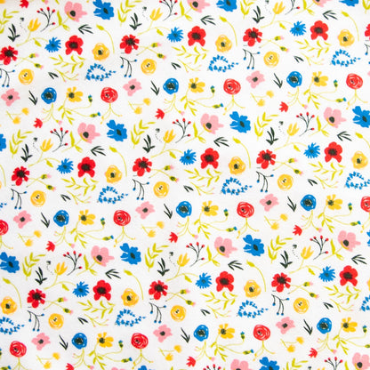 Wildflower print with yellow, pink, red and blue flowers and leaves