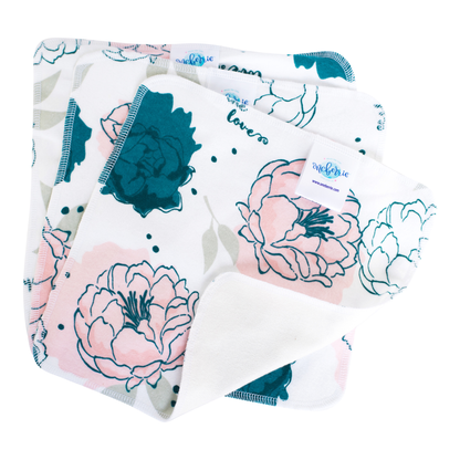 large teal and pink peony print on a white background 