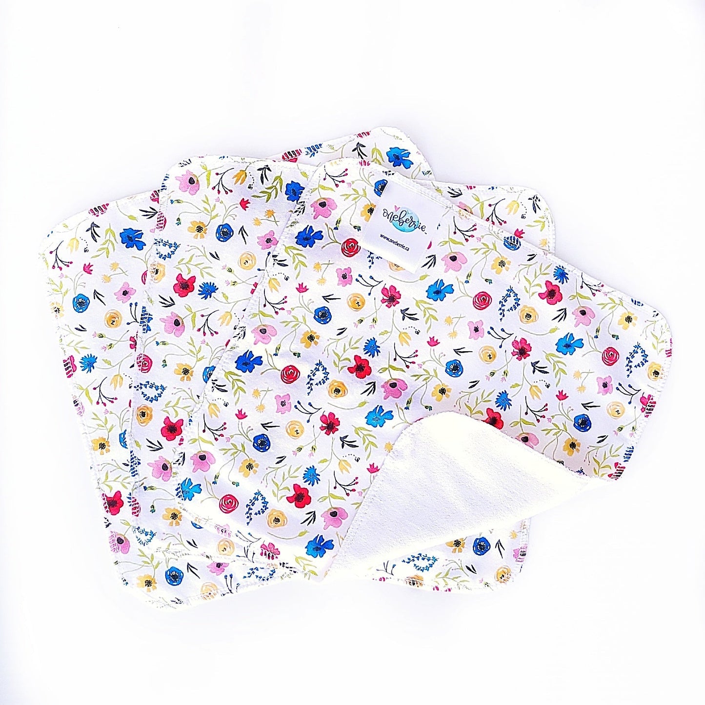 wildflower print of red, blue, yellow and pink  wildflowers on a white background 