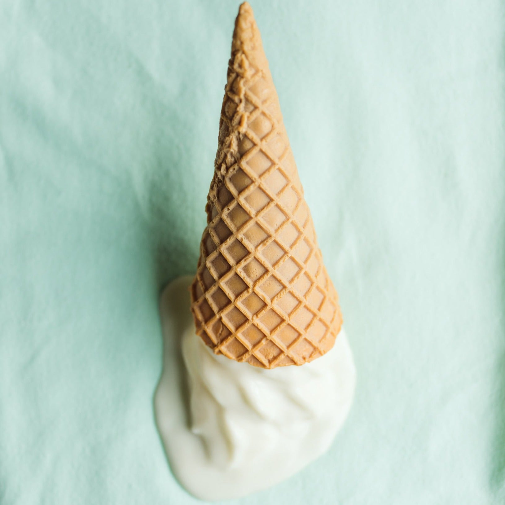 mint washcloth with a plastic ice cream on top