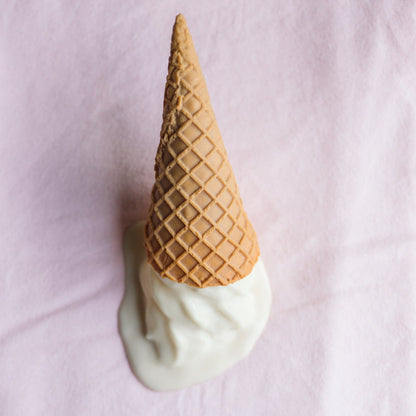 pink washcloth with a plastic ice cream on top
