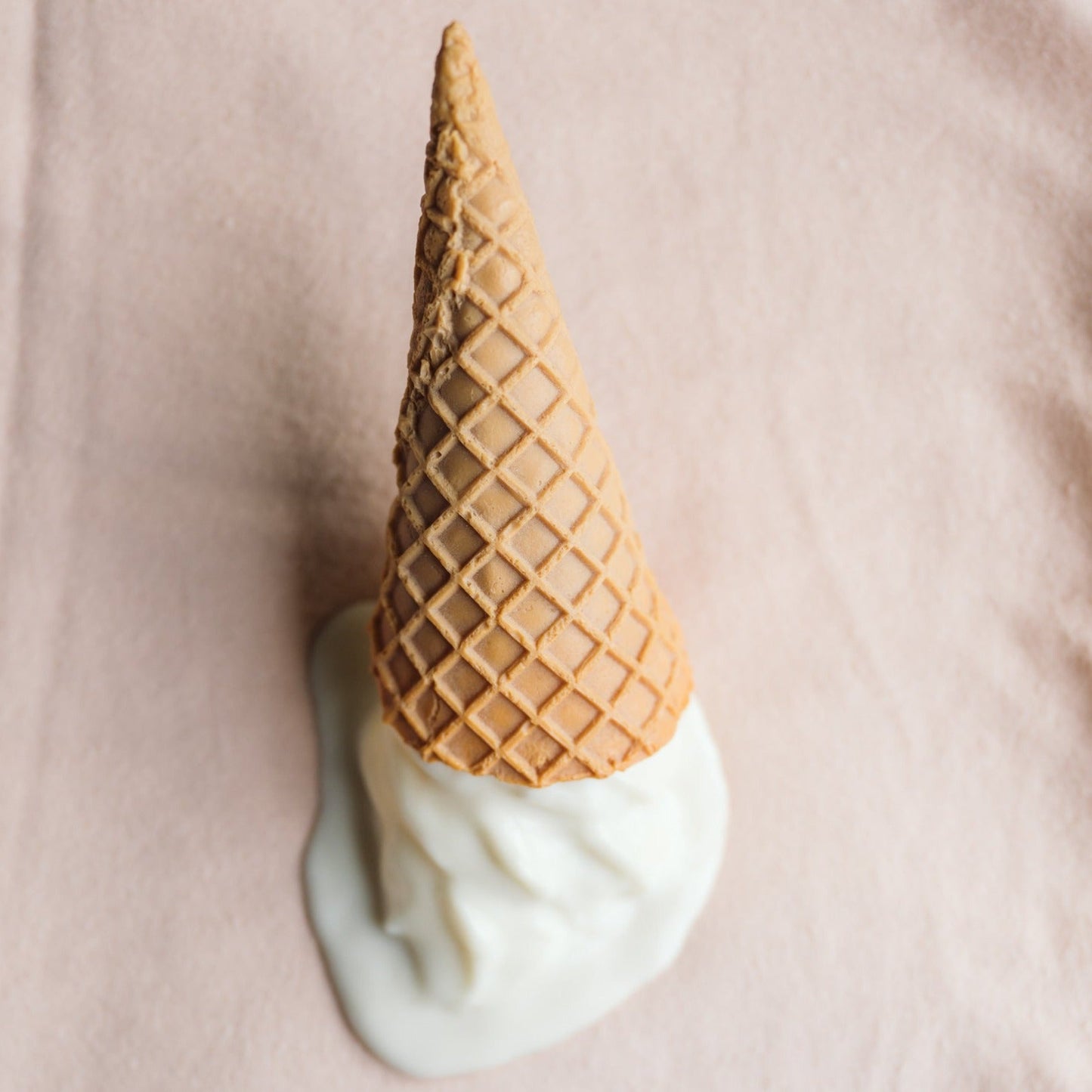 cappuccino coloured washcloth with a plastic ice cream on top