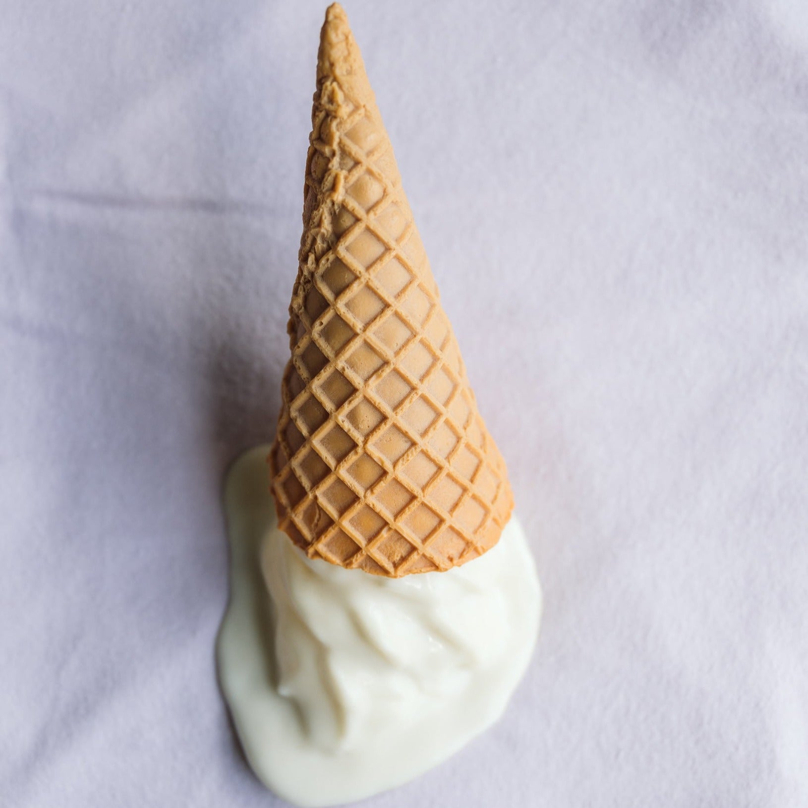 Lavender washcloth with a plastic ice cream on top