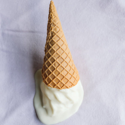 Lavender washcloth with a plastic ice cream on top