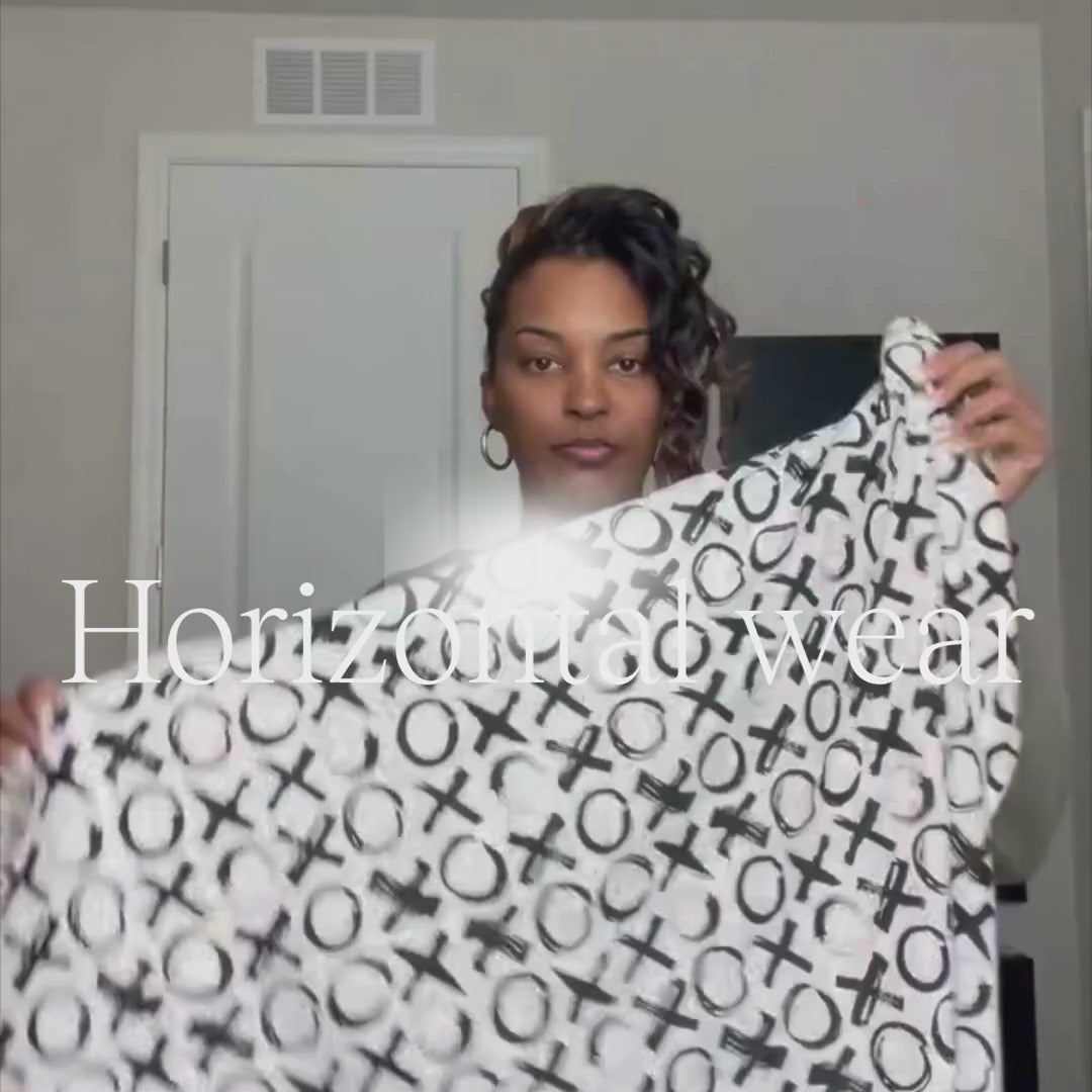 Mom bathing her baby using the horizontal wear in the Love you more print